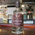 Five Saints Distilling CORUM Chocolate Orange Rum bottle on the bar, small batch gluten-free craft rum from Pennsylvania