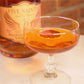 Blood orange martini in a coupe glass with dehydrated blood orange garnish, made with Five Saints Distilling Blood Orange Liqueur — craft cocktail-ready low-ABV spirit